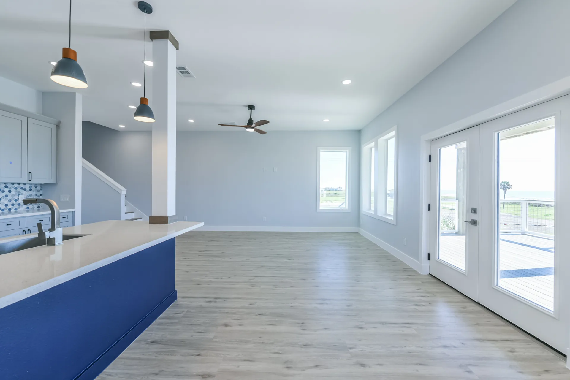 Kitchen and living area at 11 Mile with French doors leading out to the Gulf-view deck