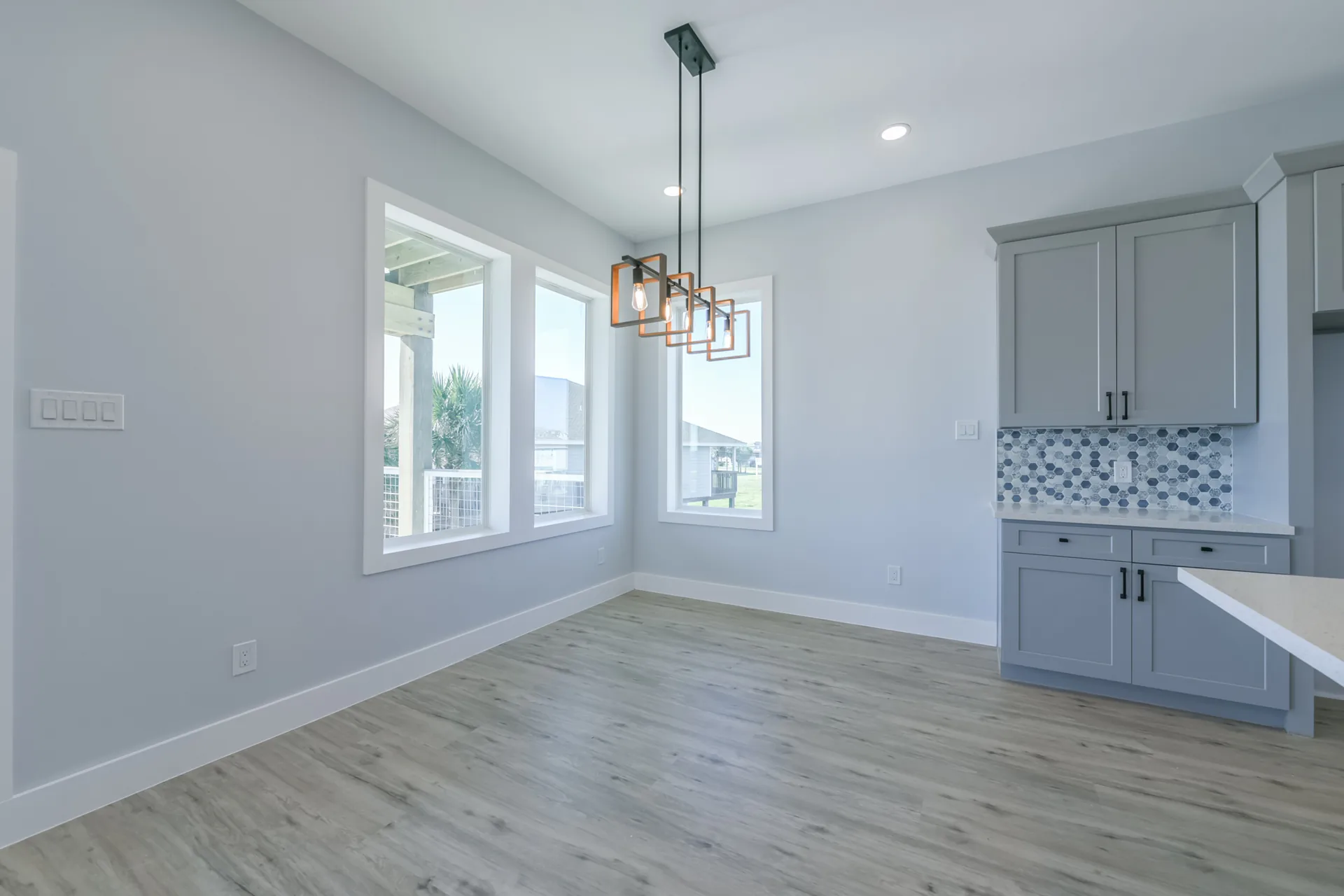 Dining nook at 11 Mile with a built-in desk area and windows overlooking the coastal prairie