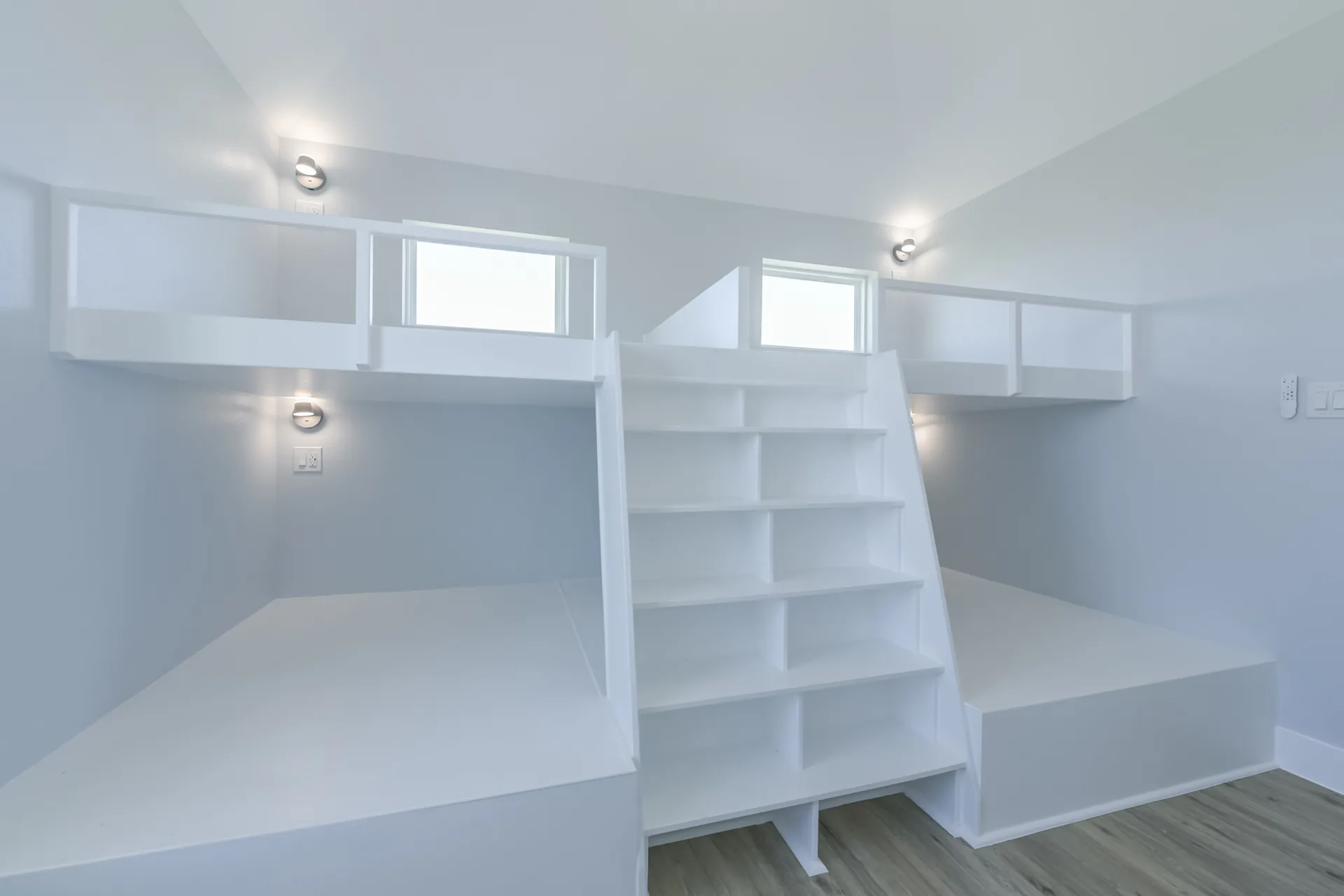 Custom bunk built-ins at 11 Mile with open shelving, cubbies, and integrated lighting