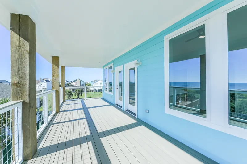 Wraparound deck at 11 Mile looking down the length of the house toward the Gulf horizon