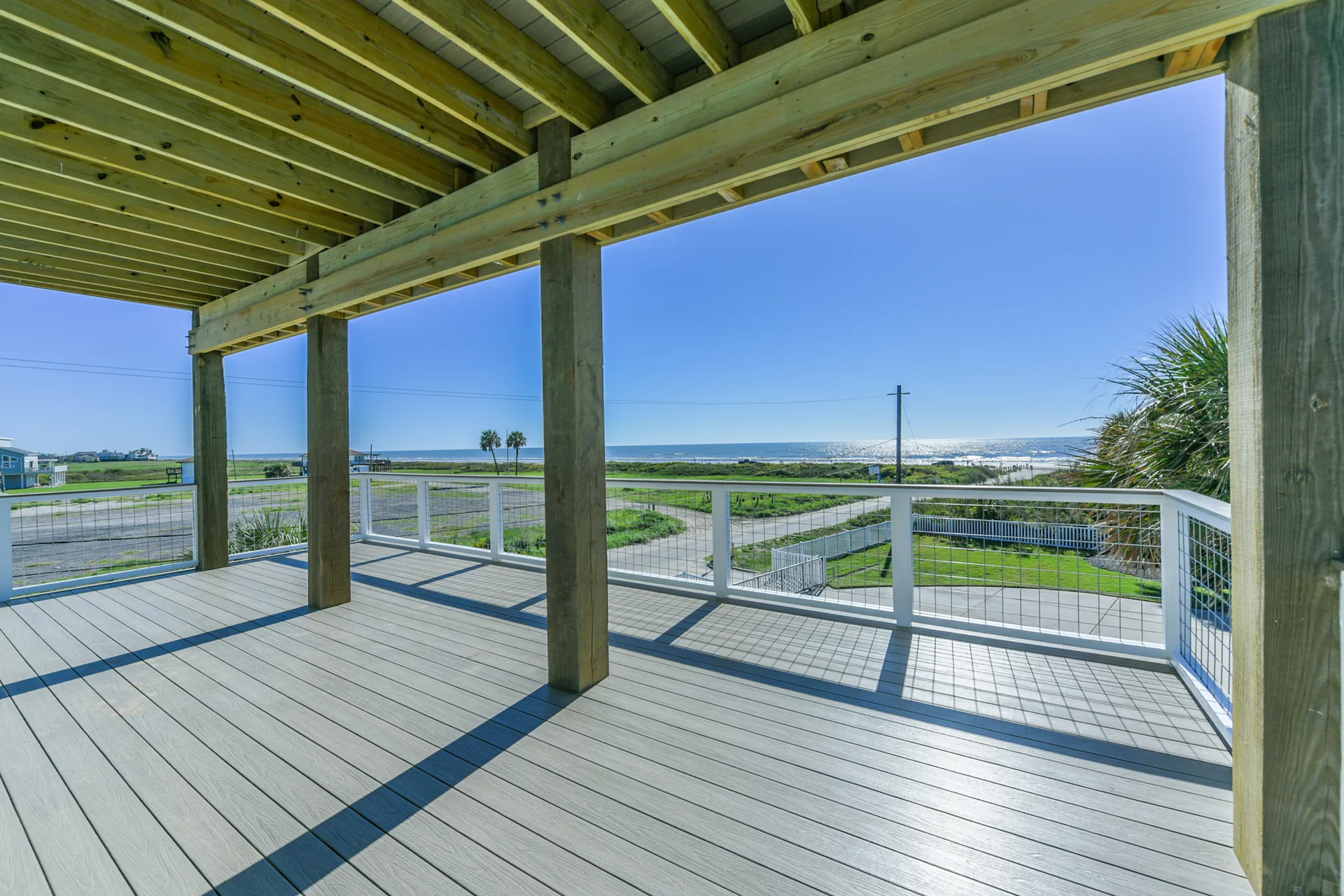 Lower covered deck at 11 Mile framed by heavy timber posts and exposed beam ceiling