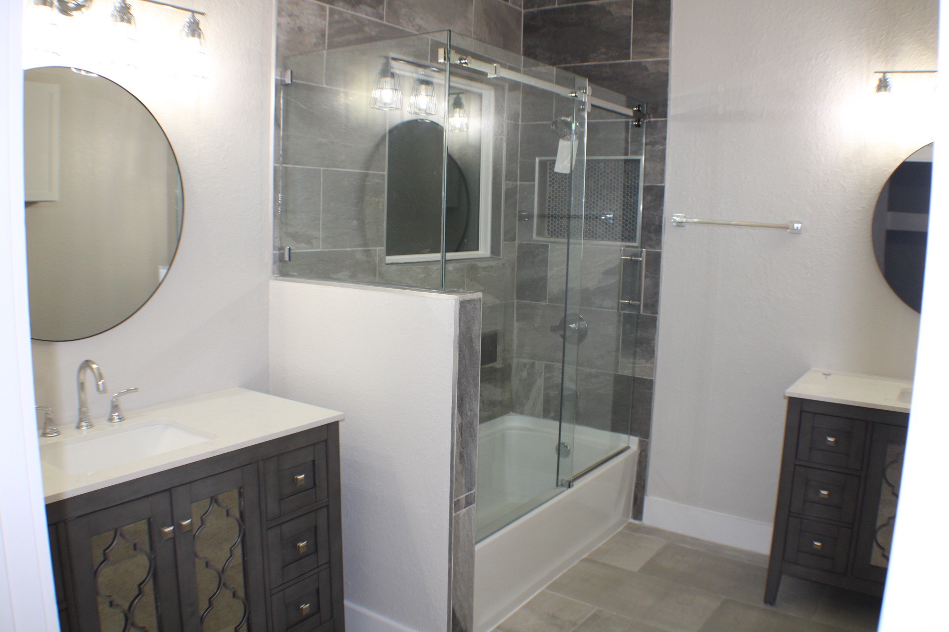Built-in laundry room with custom shelving above side-by-side washer and dryer, providing organized utility space in the Marina District home