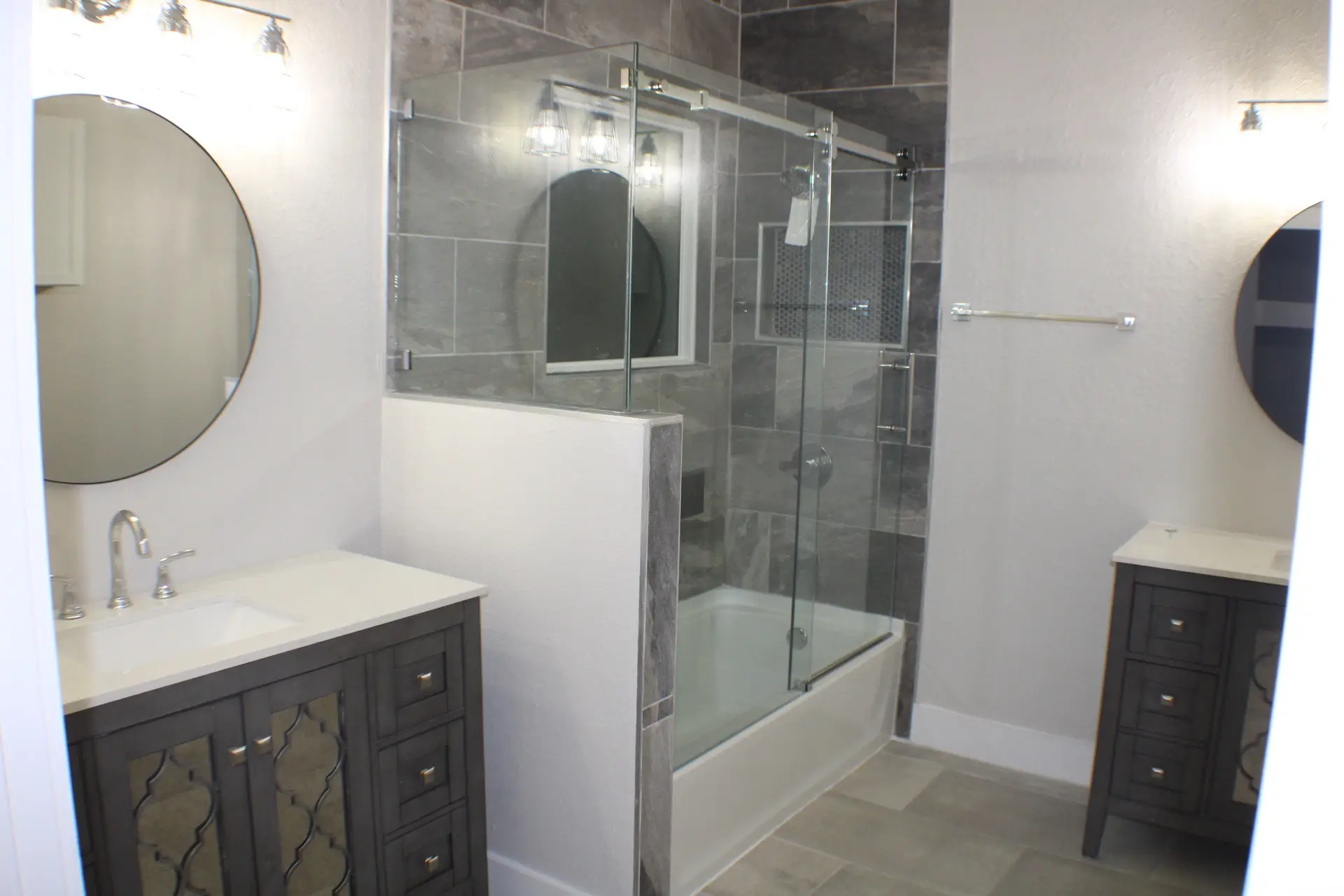 Built-in laundry room with custom shelving above side-by-side washer and dryer, providing organized utility space in the Marina District home