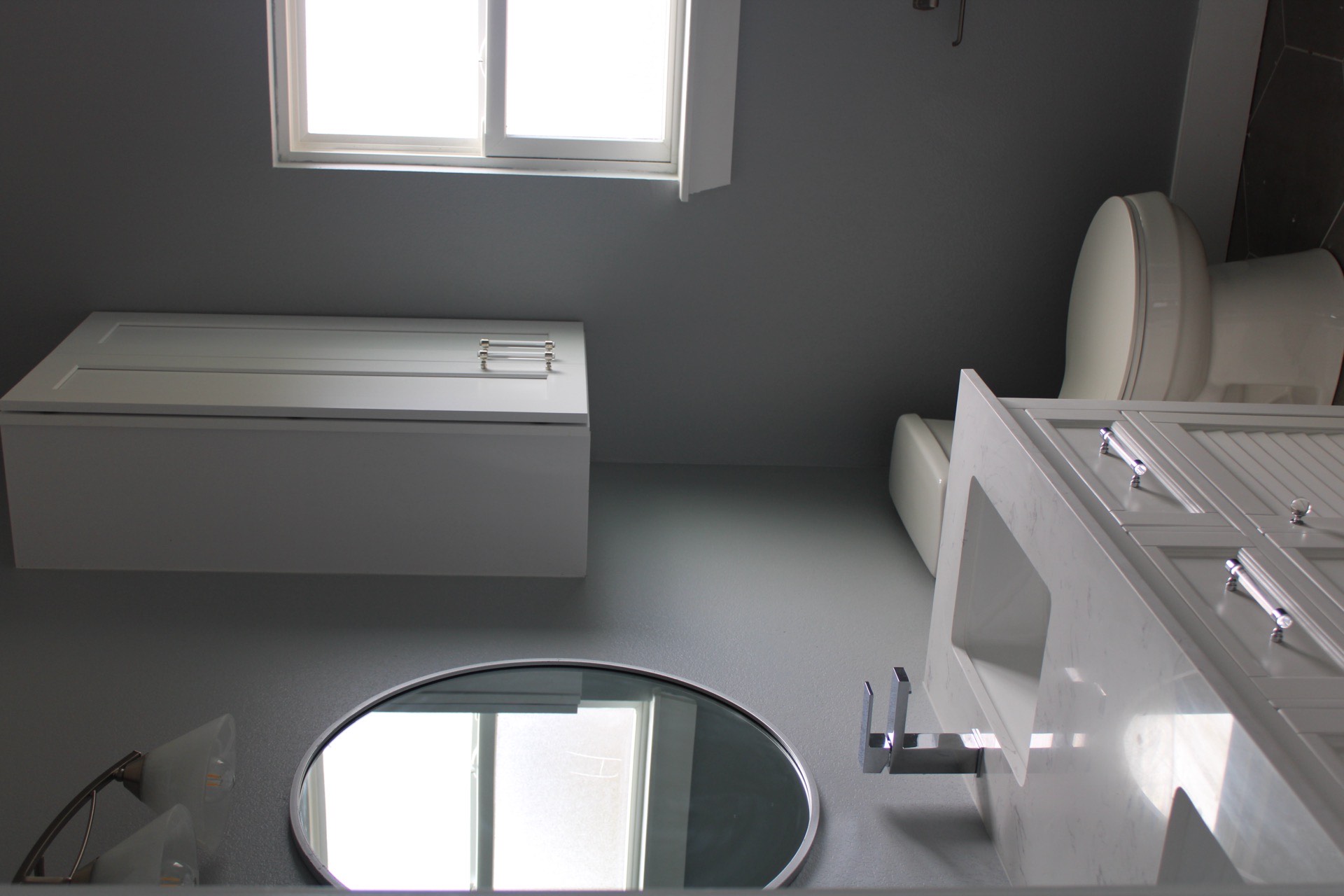 Secondary bathroom featuring a walk-in shower with marble-look tile walls, frameless glass panel, and dark wood-look plank flooring