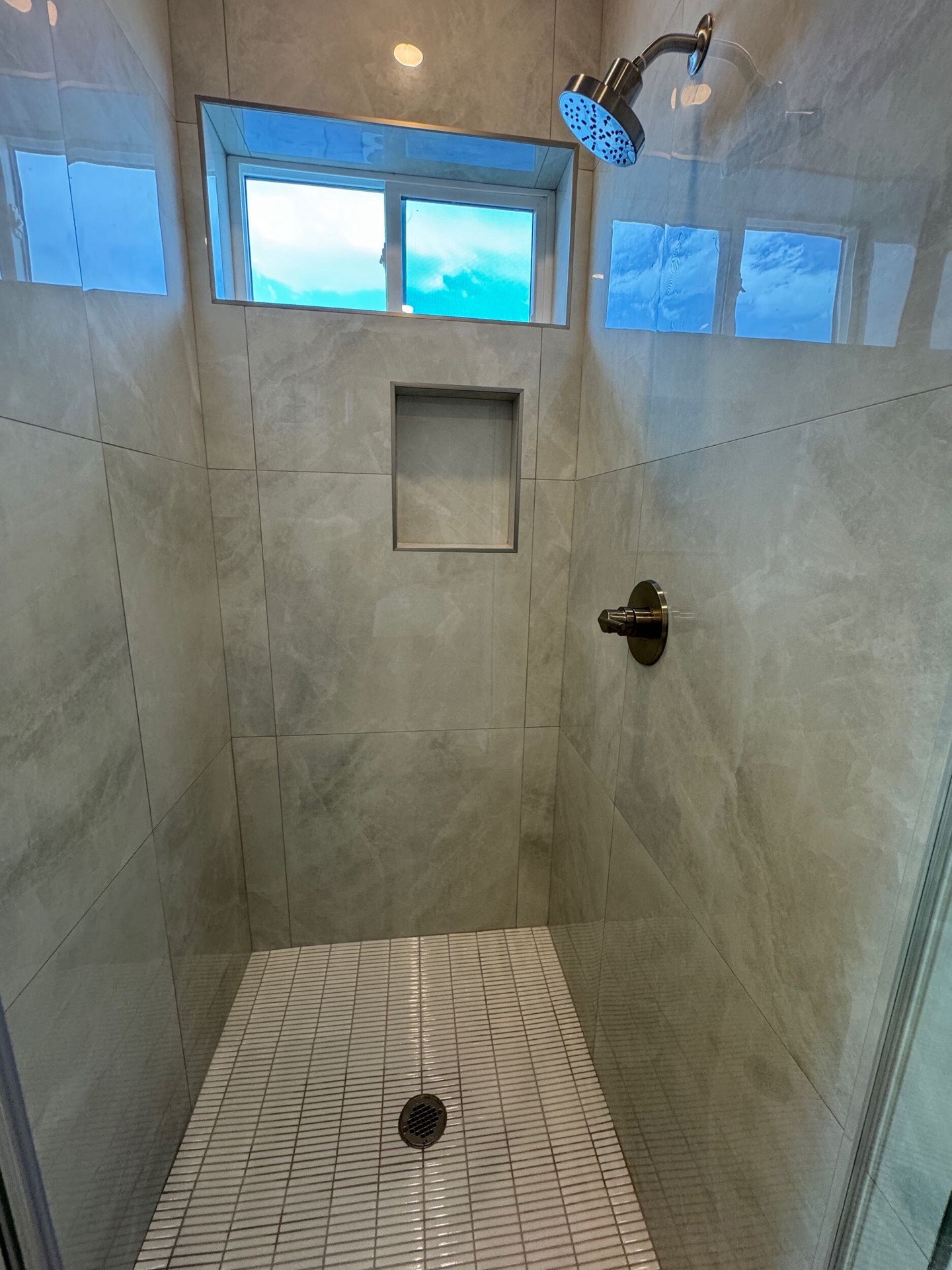 Fourth bedroom with recessed ceiling detail, natural light from dual windows, and consistent light oak hardwood throughout