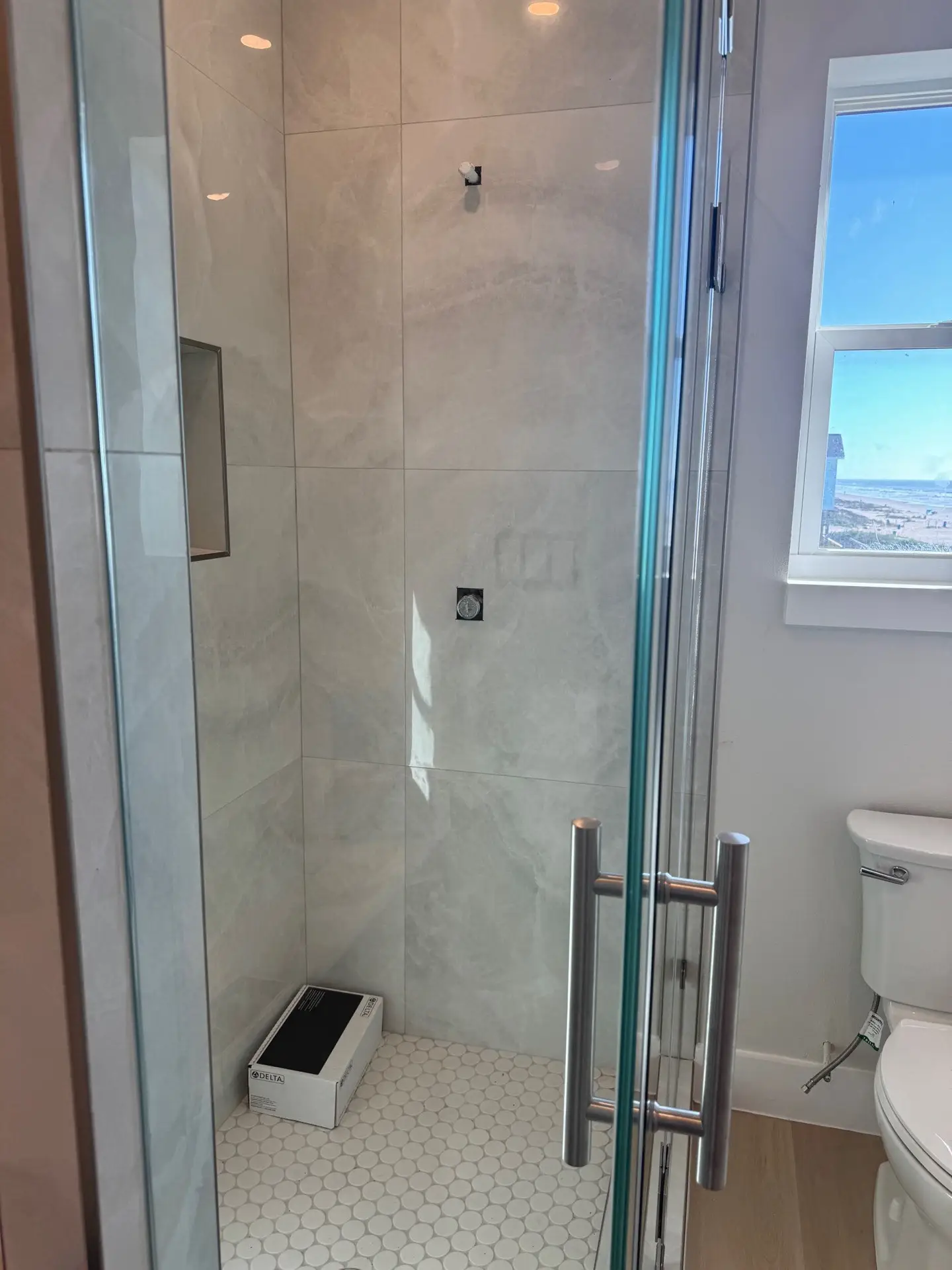 Outdoor living view from the second-story balcony looking out over Galveston Island toward the Gulf waters at golden hour