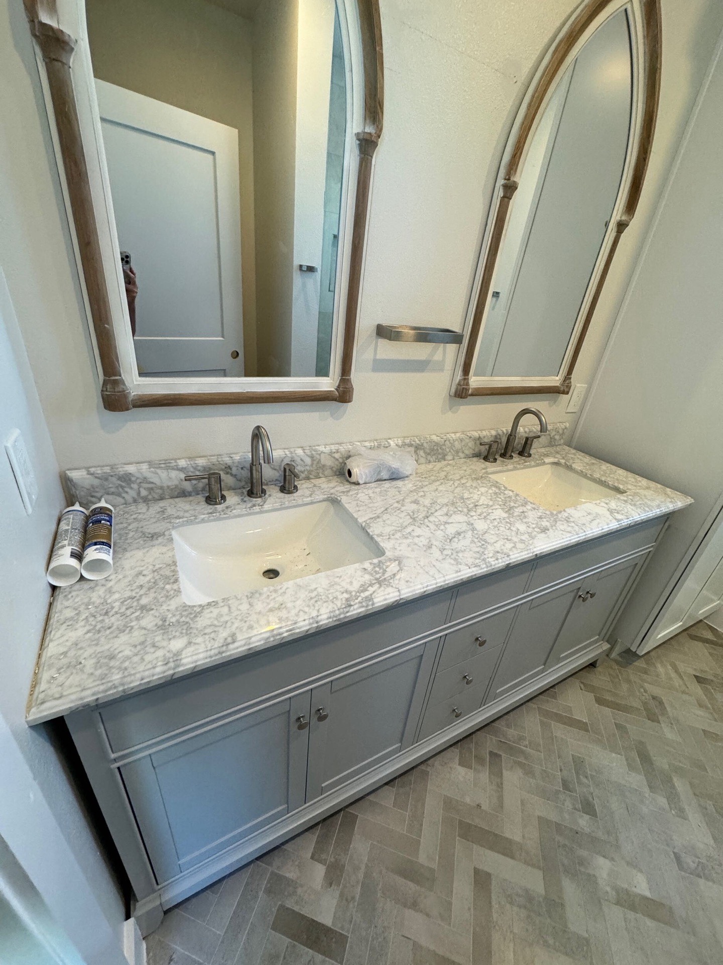 Rear exterior showcasing expansive second-floor balcony with Gulf-facing views and traditional white coastal trim work