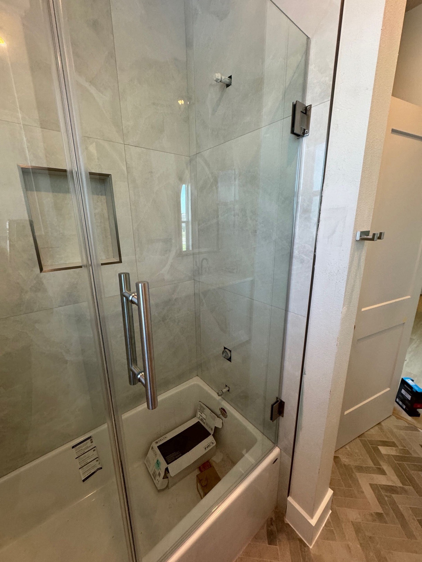 Angled exterior perspective showing the full depth of wraparound porches and classic coastal traditional architectural lines