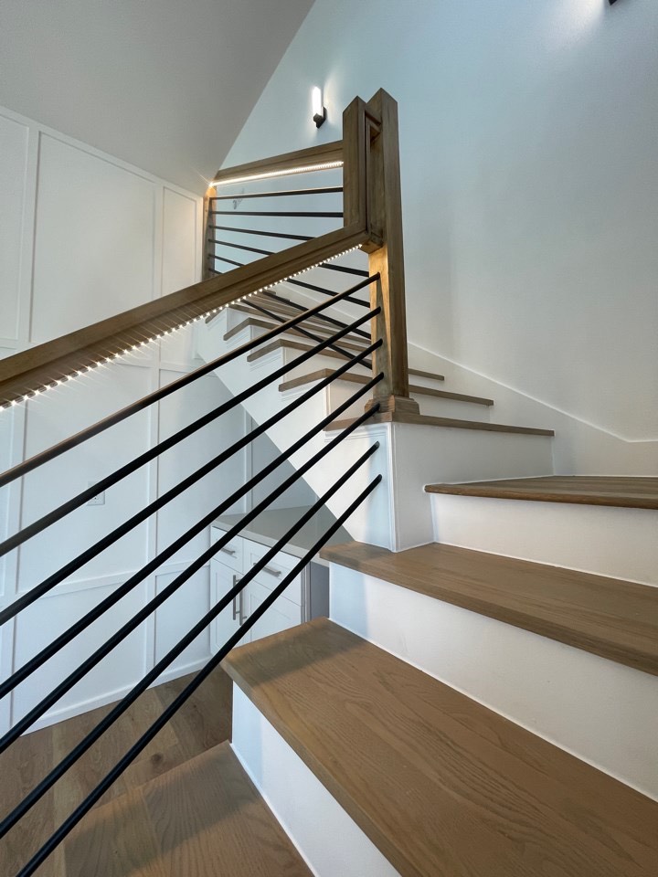 Architectural detail of the great room ceiling with recessed lighting and clean modern lines complementing the coastal design