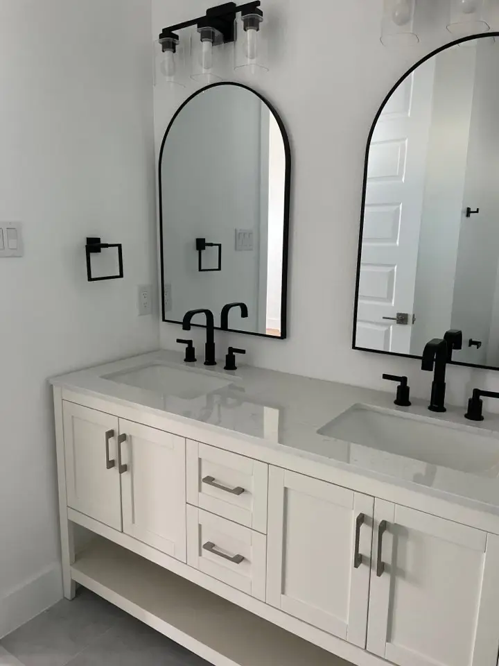 Master suite walk-in closet with custom built-in shelving, hanging rods, and drawer storage in the 131 Gulf Drive home