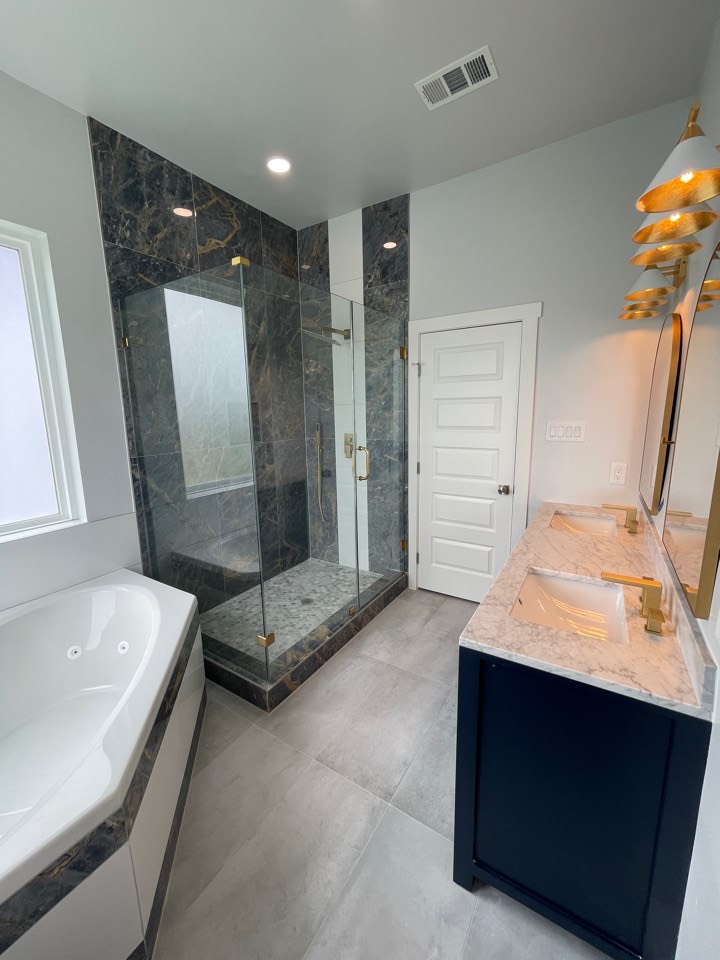 Living area seating arrangement beneath the open mezzanine with views through the windows to the Galveston Island coastline