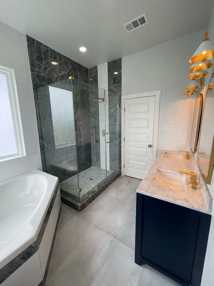Living area seating arrangement beneath the open mezzanine with views through the windows to the Galveston Island coastline