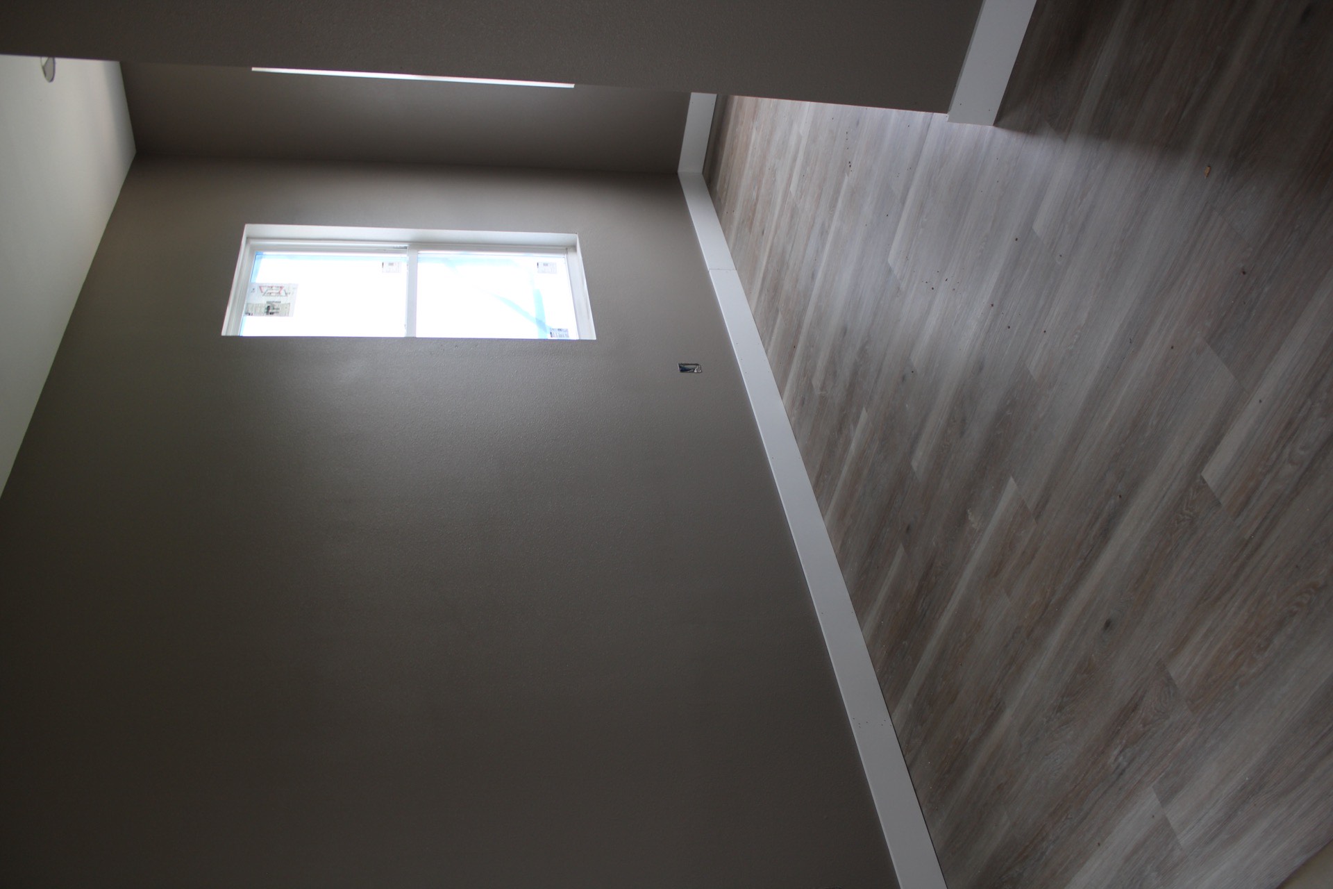 Third bedroom configured with ample closet space, LVP flooring, and large window providing natural light and island views