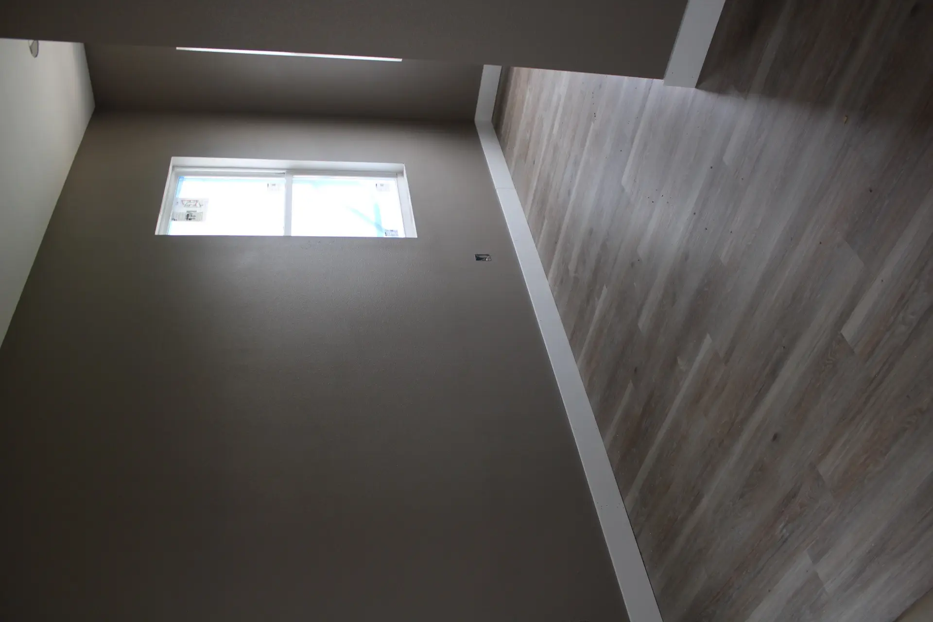 Third bedroom configured with ample closet space, LVP flooring, and large window providing natural light and island views