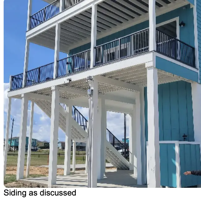 Secondary bedroom with high ceilings, modern ceiling fan, and the bright airy atmosphere created by the home's generous window placement