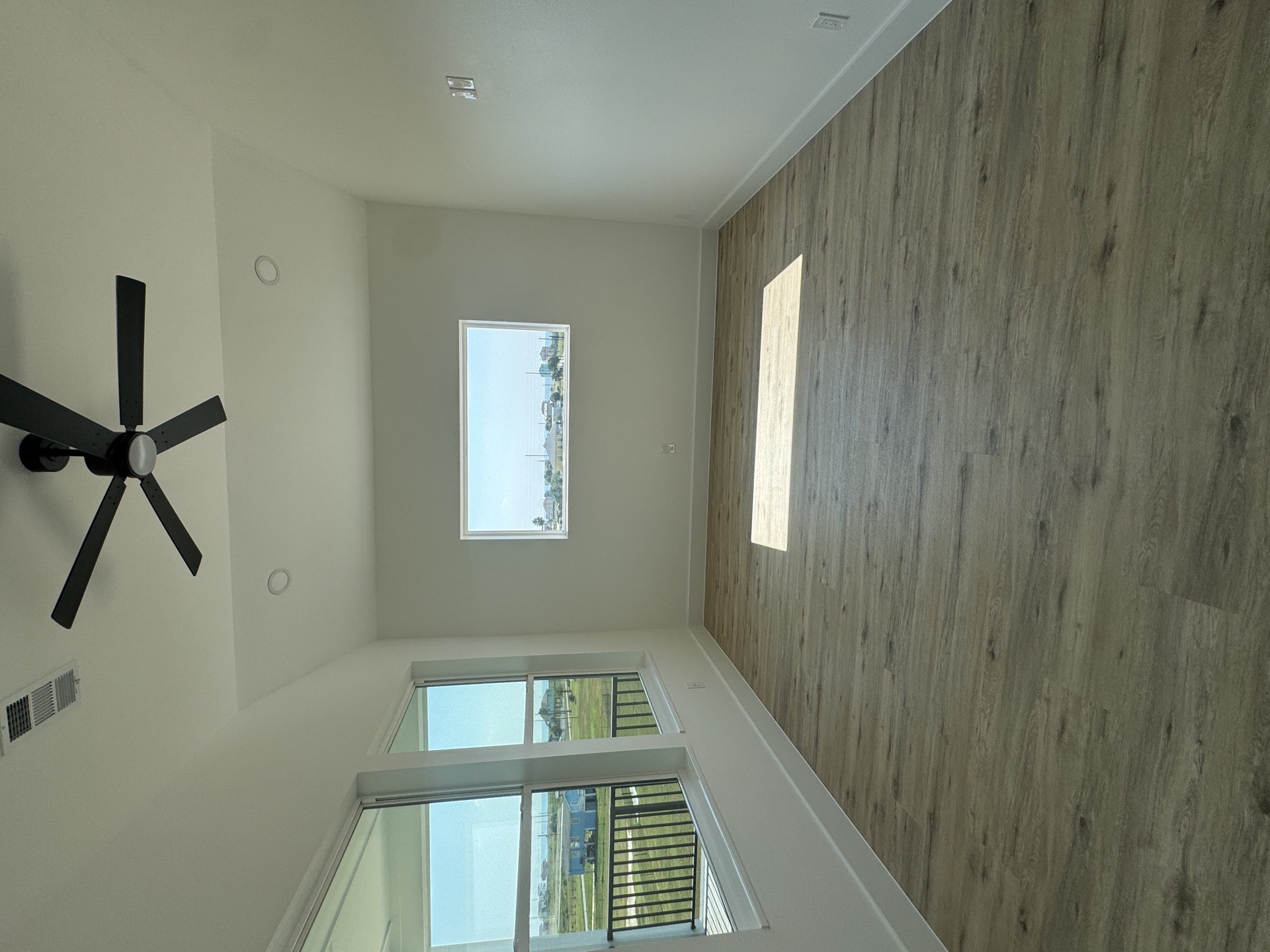 Large glass walk-in shower with gray marble-look tile walls and mosaic accent niche providing a spa-like experience in the master bathroom
