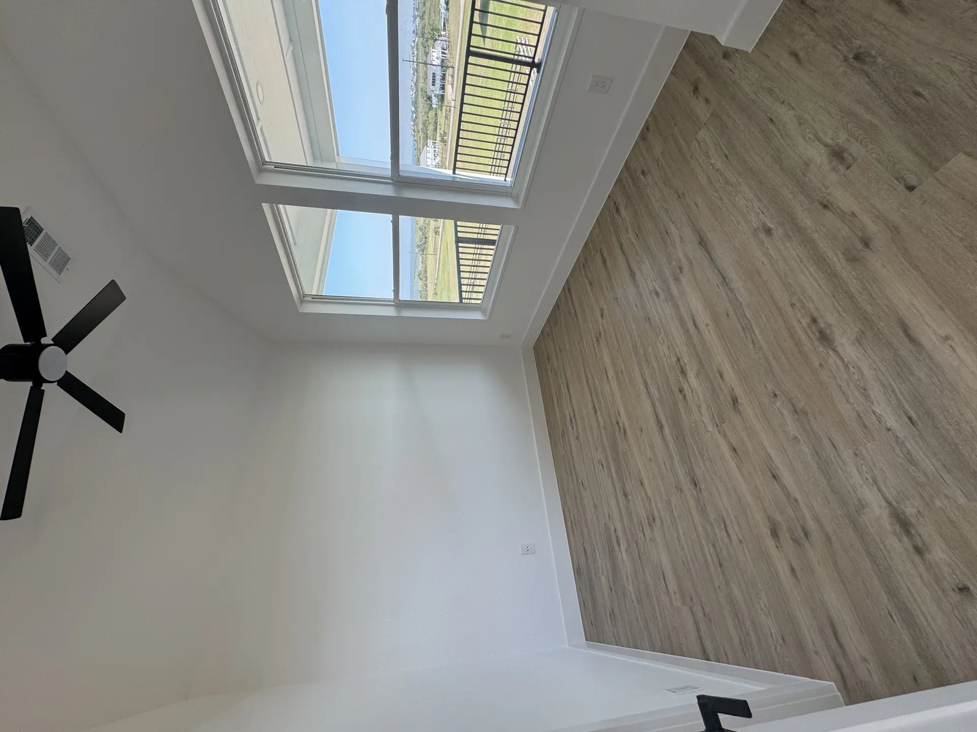 Mosaic tile floor detail surrounding the freestanding tub, showcasing the intricate patterned tilework and luxury finish selections
