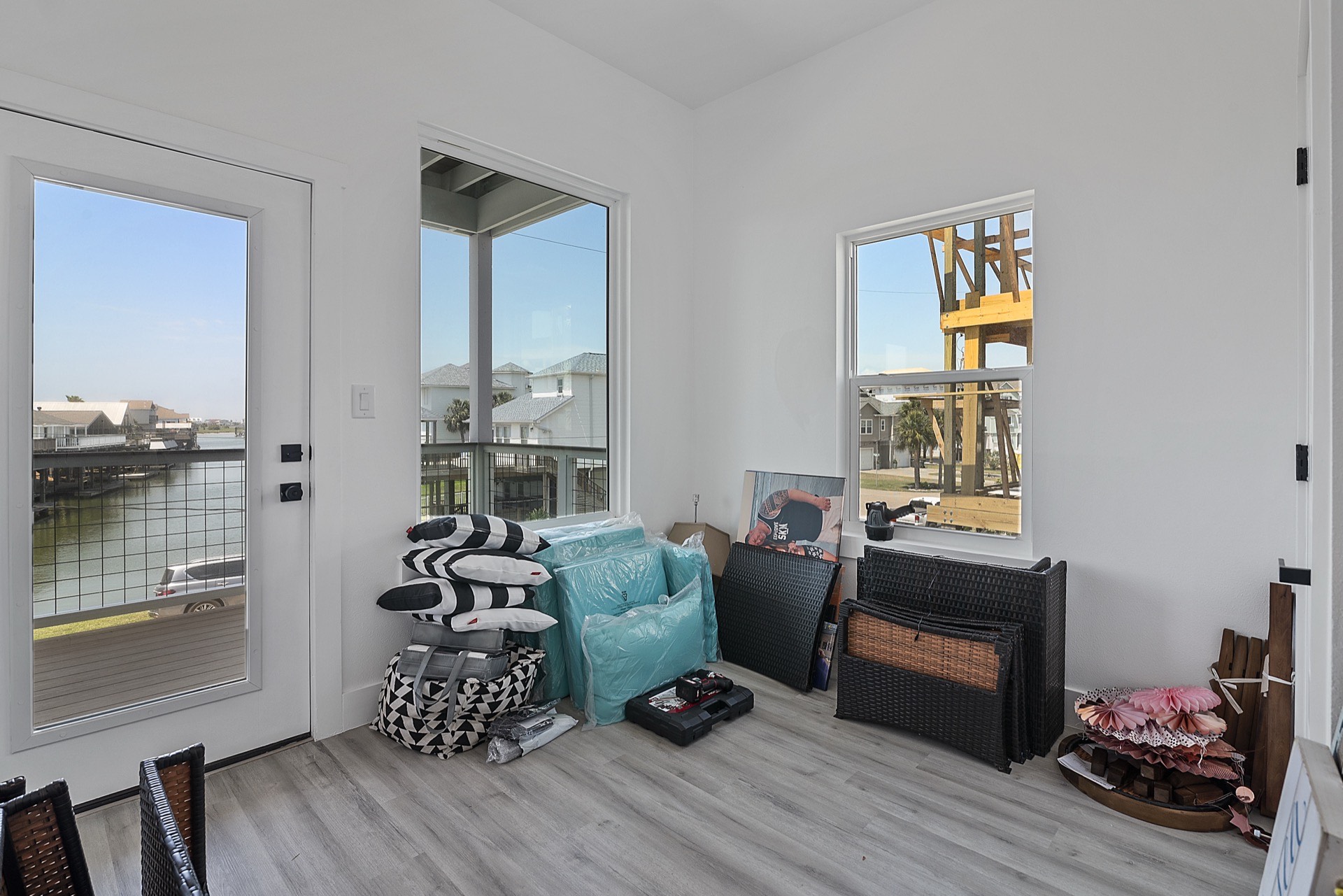 Kitchen prep area with white upper cabinets, glass-front doors, gold knobs, and hexagonal marble tile extending along the full backsplash wall