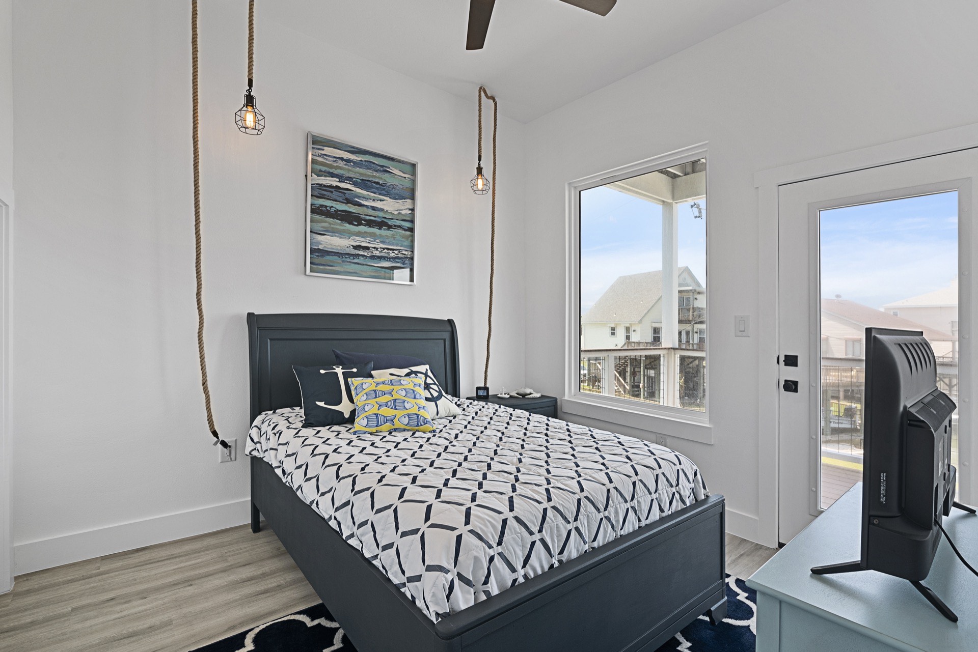 Chef's kitchen with large white quartz island, gold pendant lighting, hexagonal marble backsplash, and built-in wine cooler at 3742 Laguna