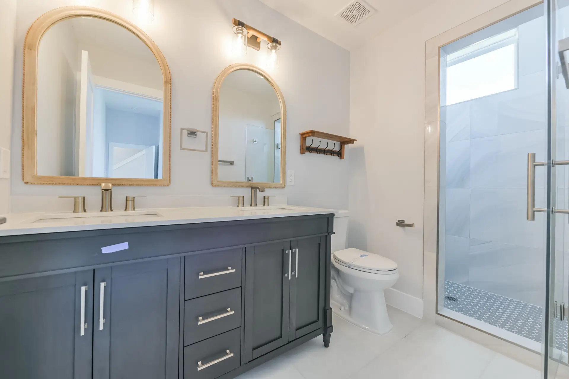 Custom bathroom vanity with marble countertop and modern fixtures at 4003 Pirates Beach