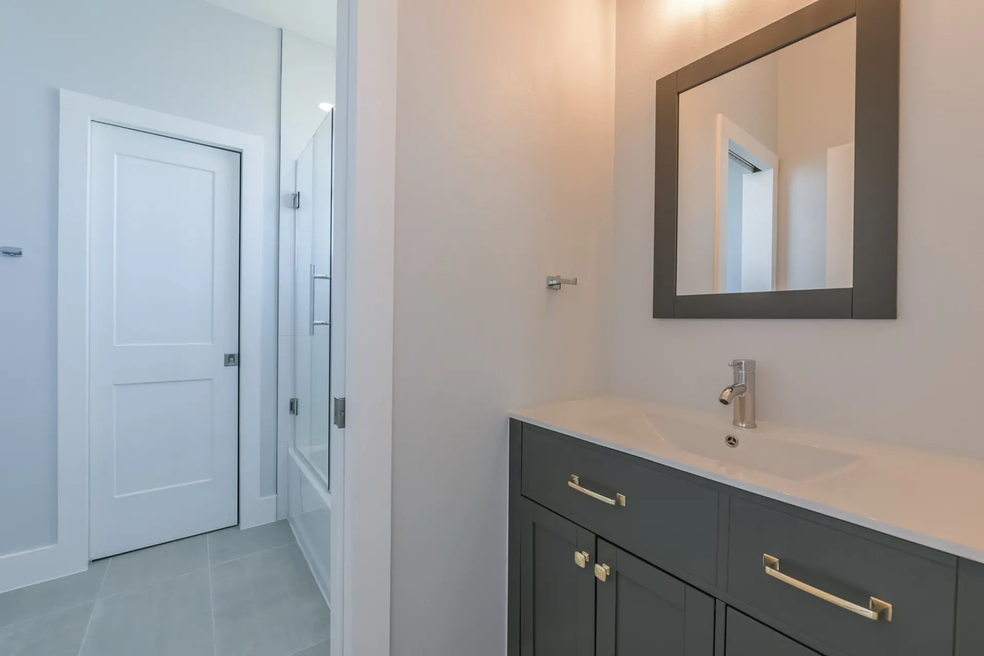 Walk-in shower with floor-to-ceiling tile and rain shower head at 4003 Pirates Beach