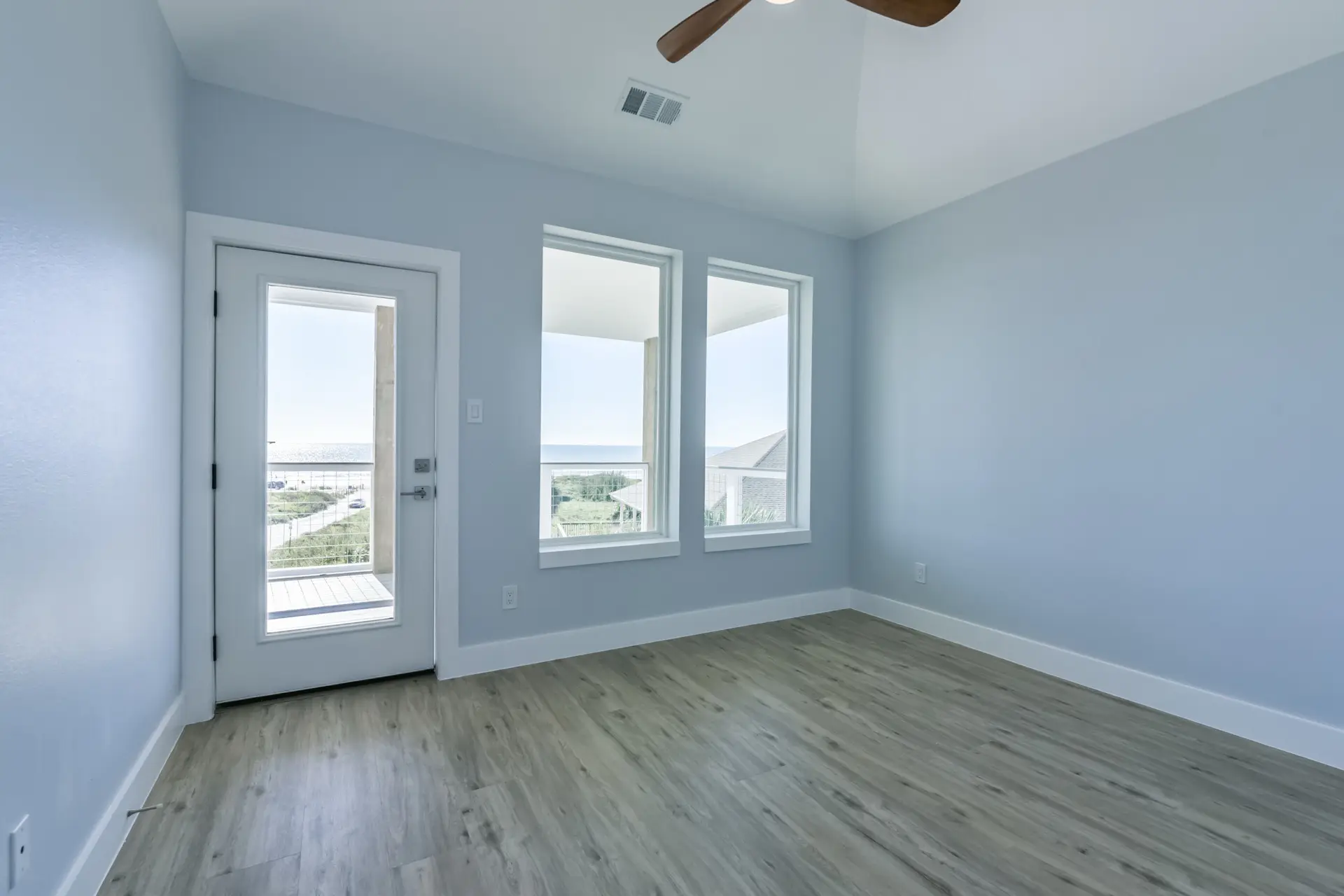 Ocean-view bedroom with balcony door access at 4003 Pirates Beach beachfront home