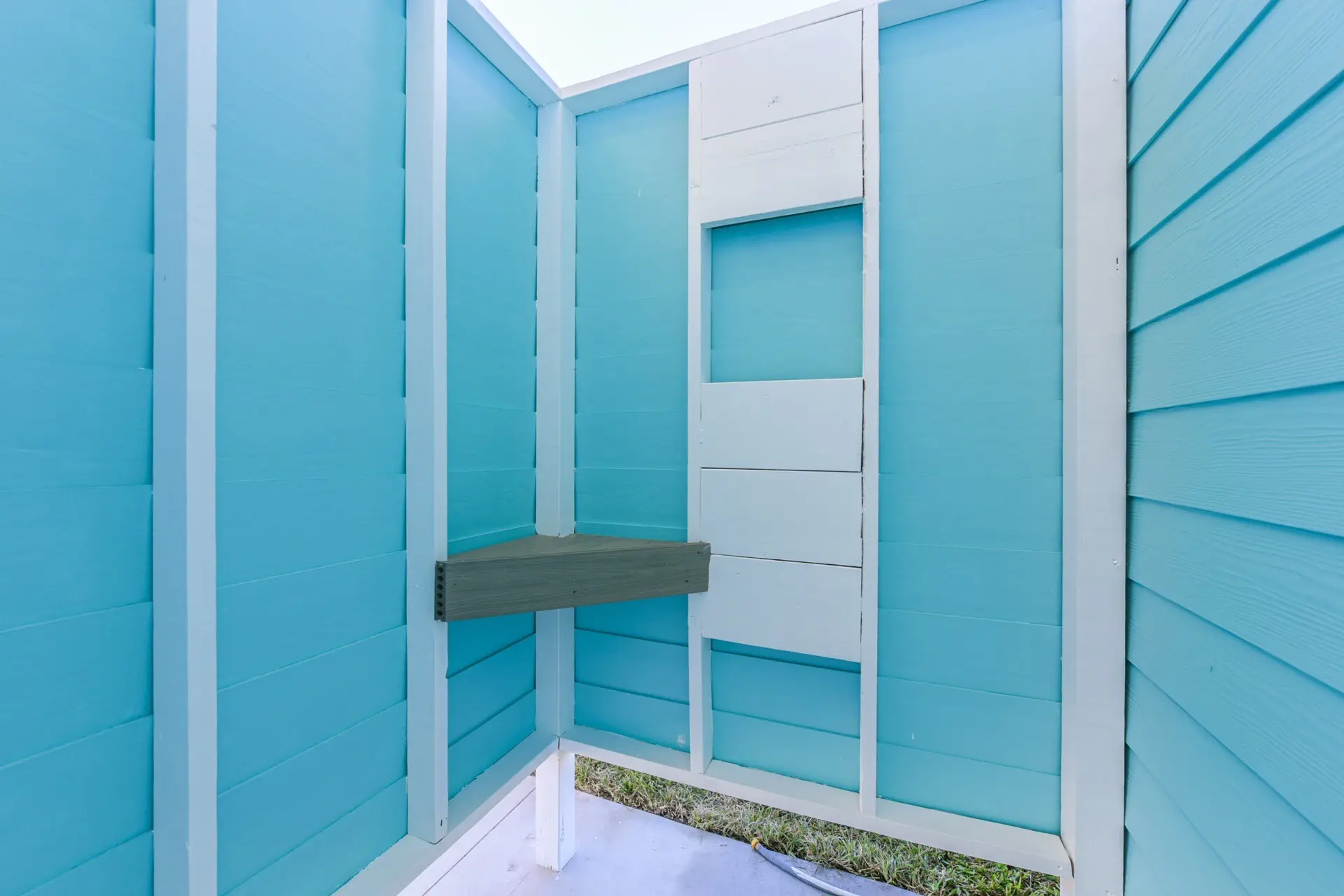 Custom outdoor shower with coastal tile at 4003 Pirates Beach beachfront home