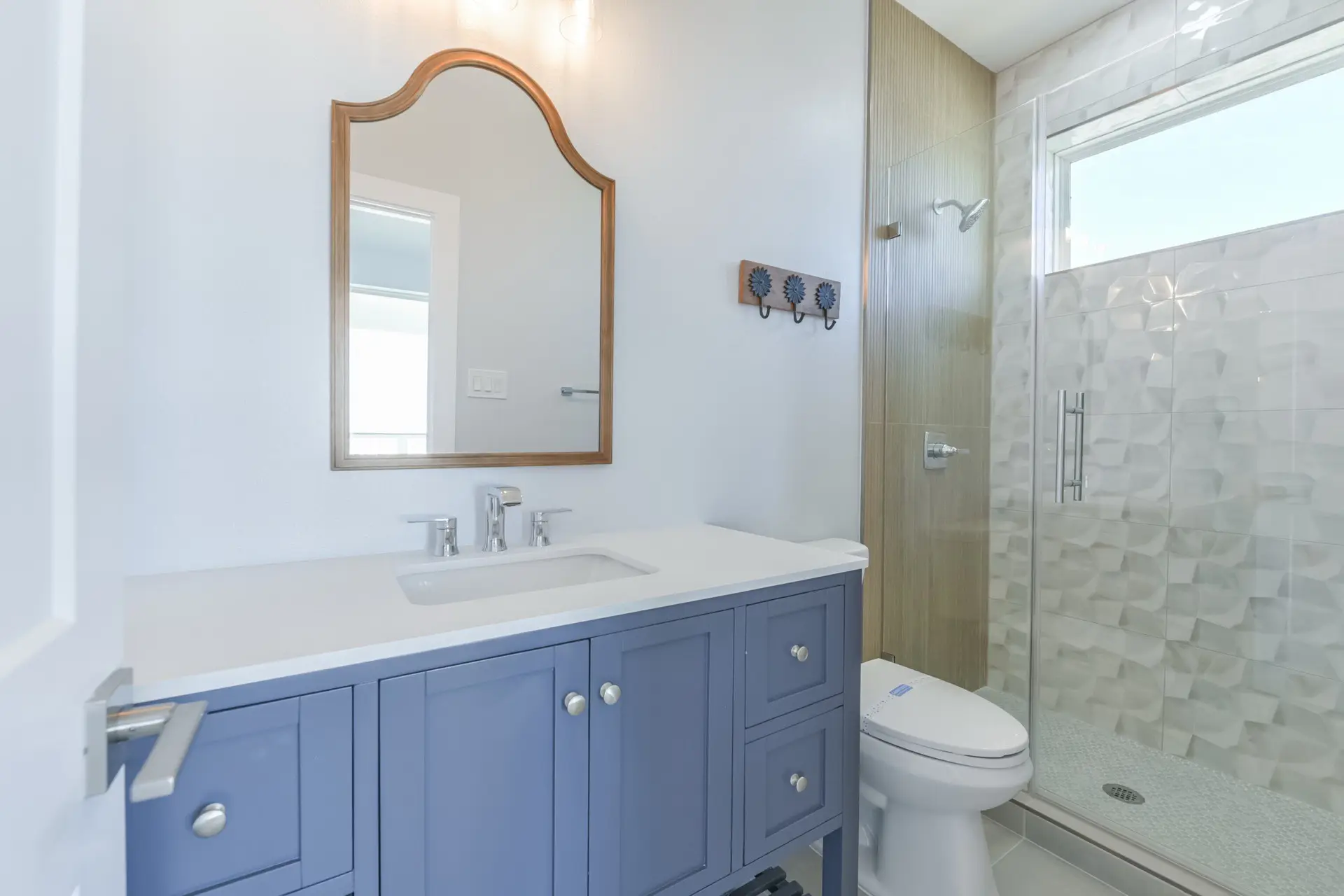 Spa-inspired bathroom with soaking tub and premium finishes at 4003 Pirates Beach custom home