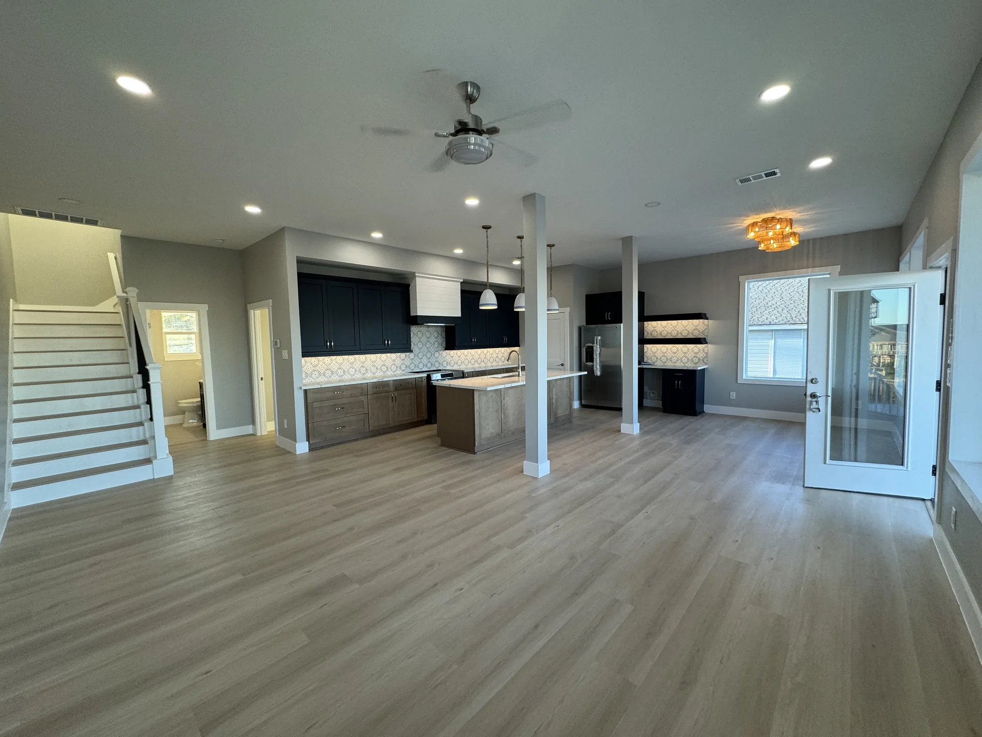 Galleon living area with the staircase to the upper level and sightlines straight through to the kitchen