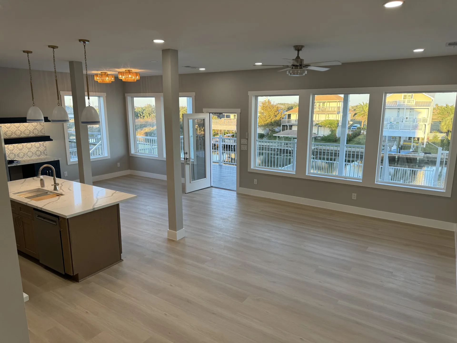 Galleon kitchen and dining area with windows framing the canal and abundant natural light