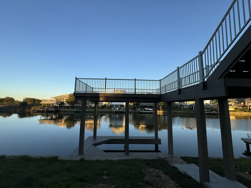 Private boat dock and covered slip at Galleon photographed at dusk, with the canal reflecting the evening sky