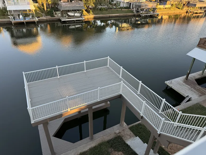 Elevated view of the Galleon waterside deck and dock platform extending over the Jamaica Beach canal