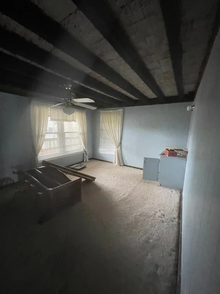 Before: interior stripped to bare surfaces during the demolition phase