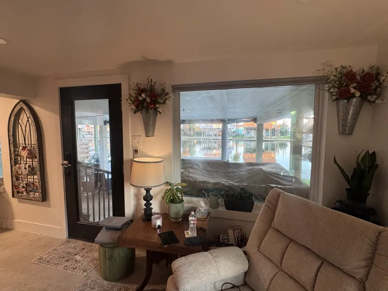 Sitting area of the Galveston one bedroom renovation with a picture window overlooking the water