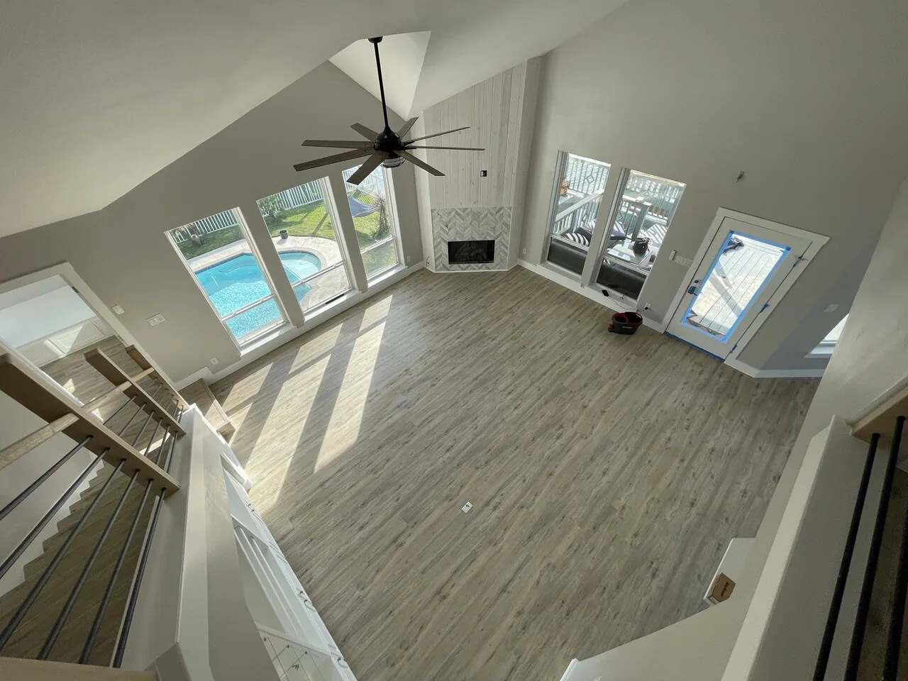 After: view down into the Tern great room from the loft, showing the new railing and window wall