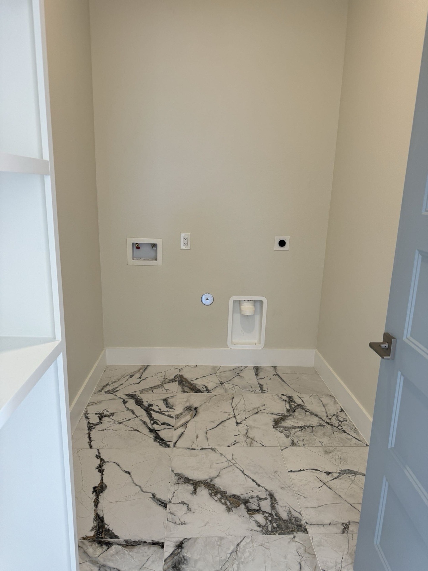 Dining area adjacent to the kitchen with crown molding, oak hardwood floors, and large windows framing views of West Bay