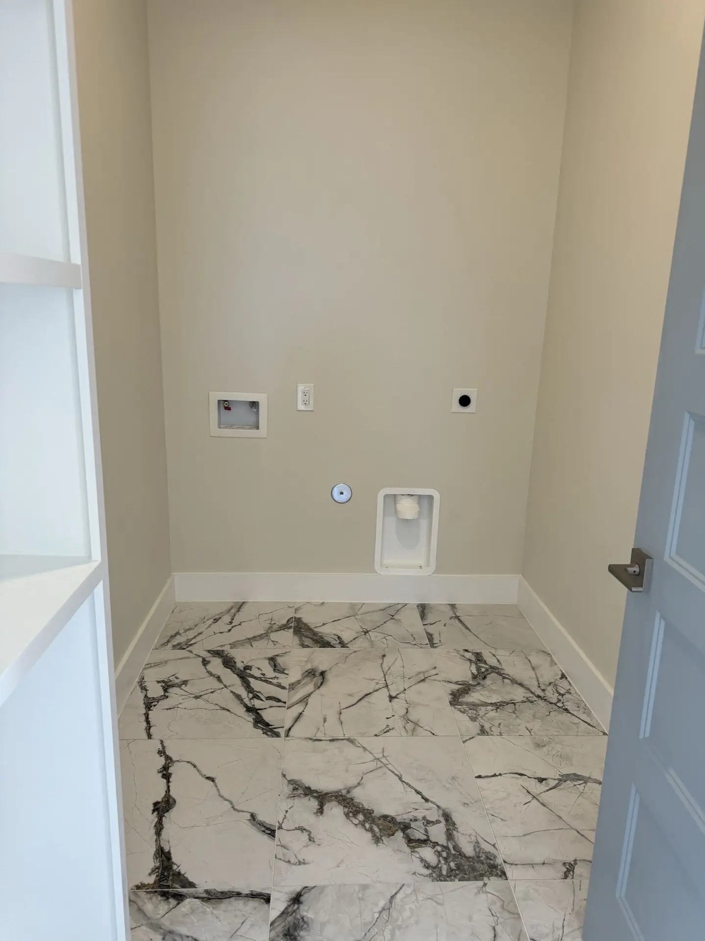 Dining area adjacent to the kitchen with crown molding, oak hardwood floors, and large windows framing views of West Bay