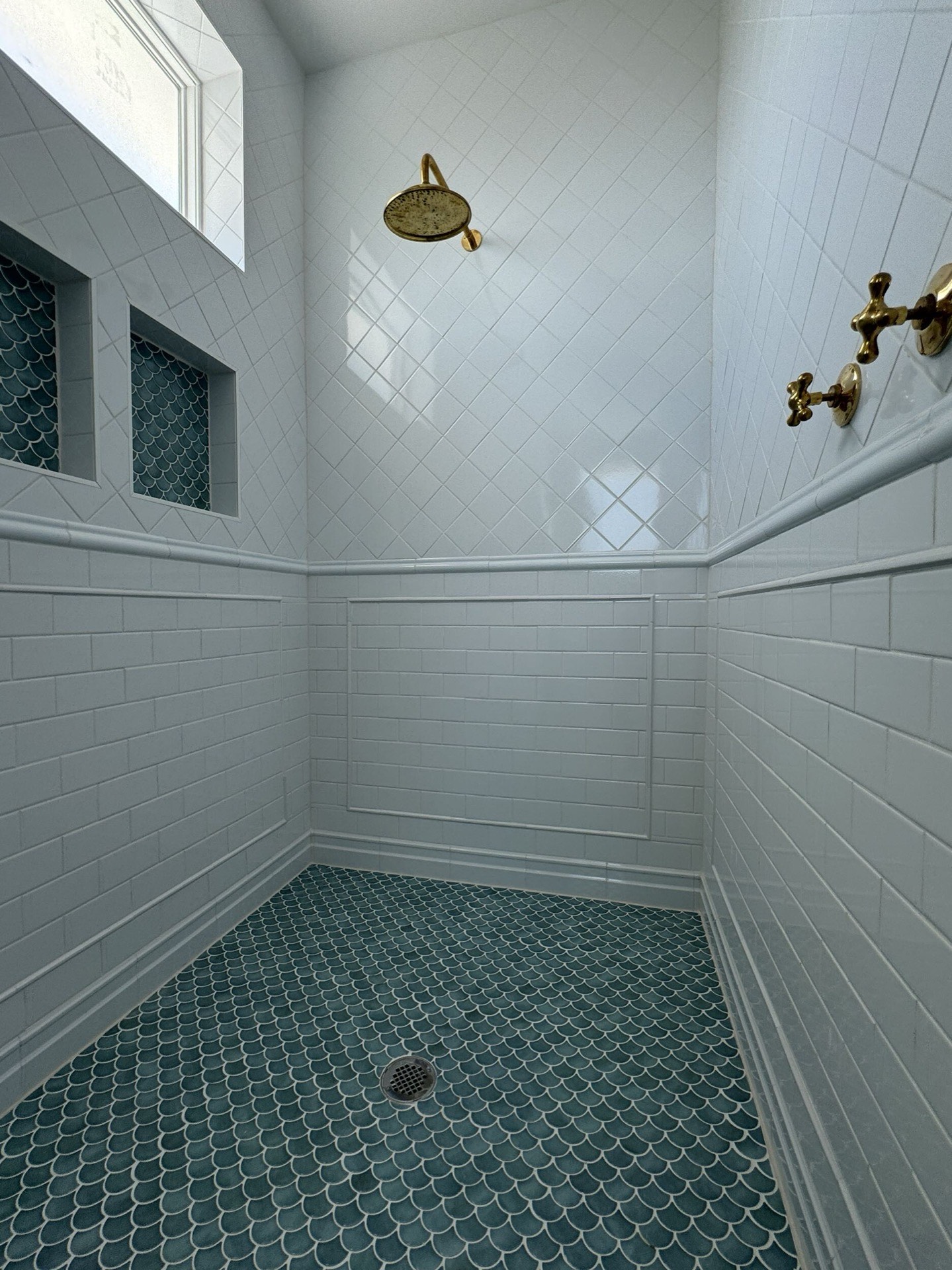 Master suite walk-in closet with custom built-in organization system, shelving, and ample storage in the Galveston waterfront home