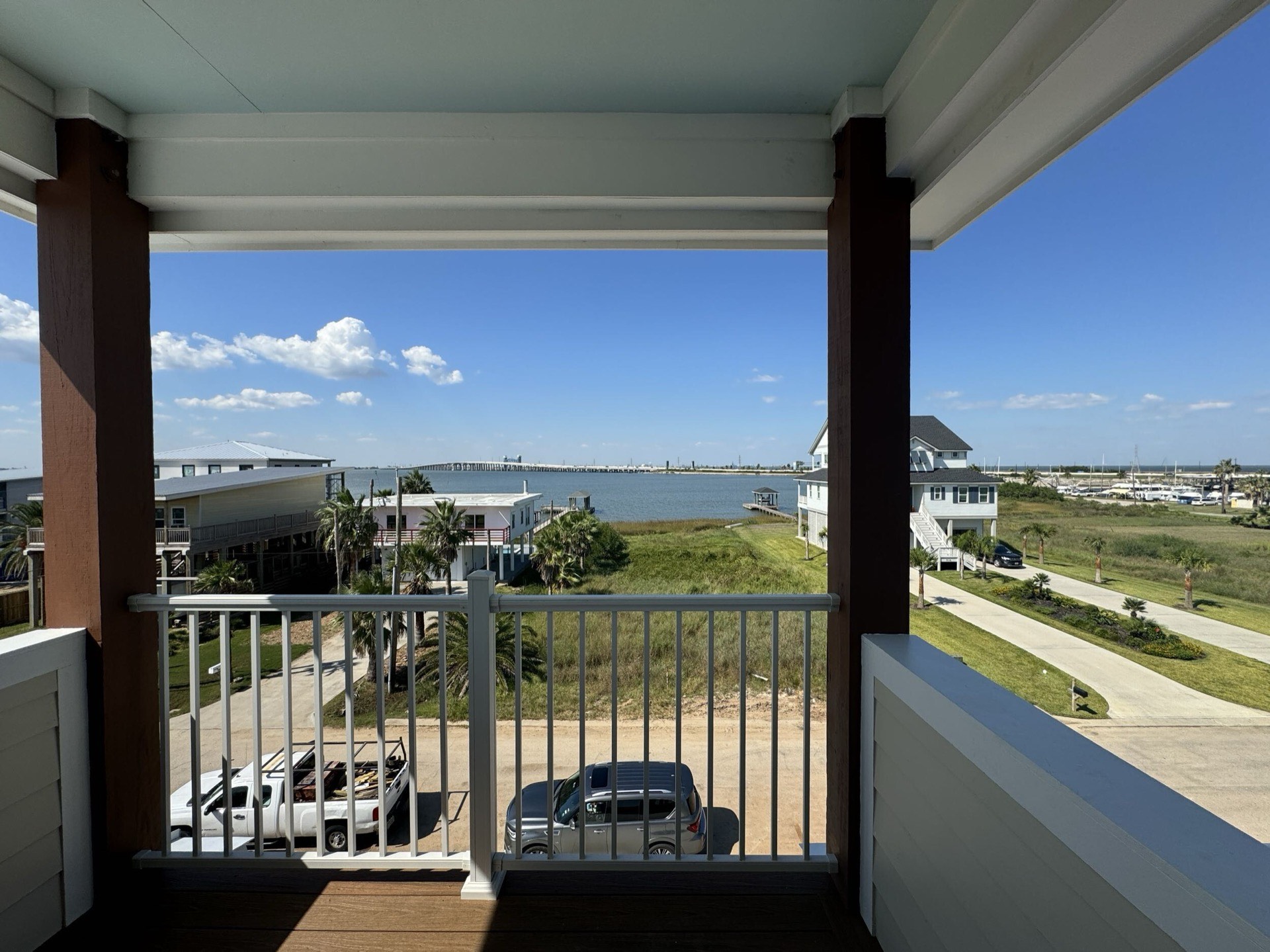Second guest bedroom with warm neutral tones, wide-plank oak floors, and traditional Craftsman-style trim and molding