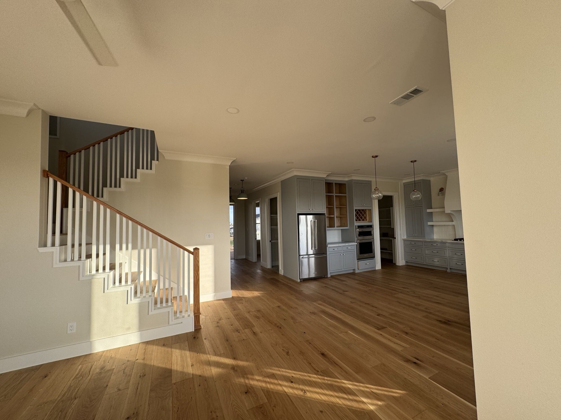 Guest bathroom with clean tile work, traditional vanity, and Craftsman-inspired hardware complementing the home's coastal style