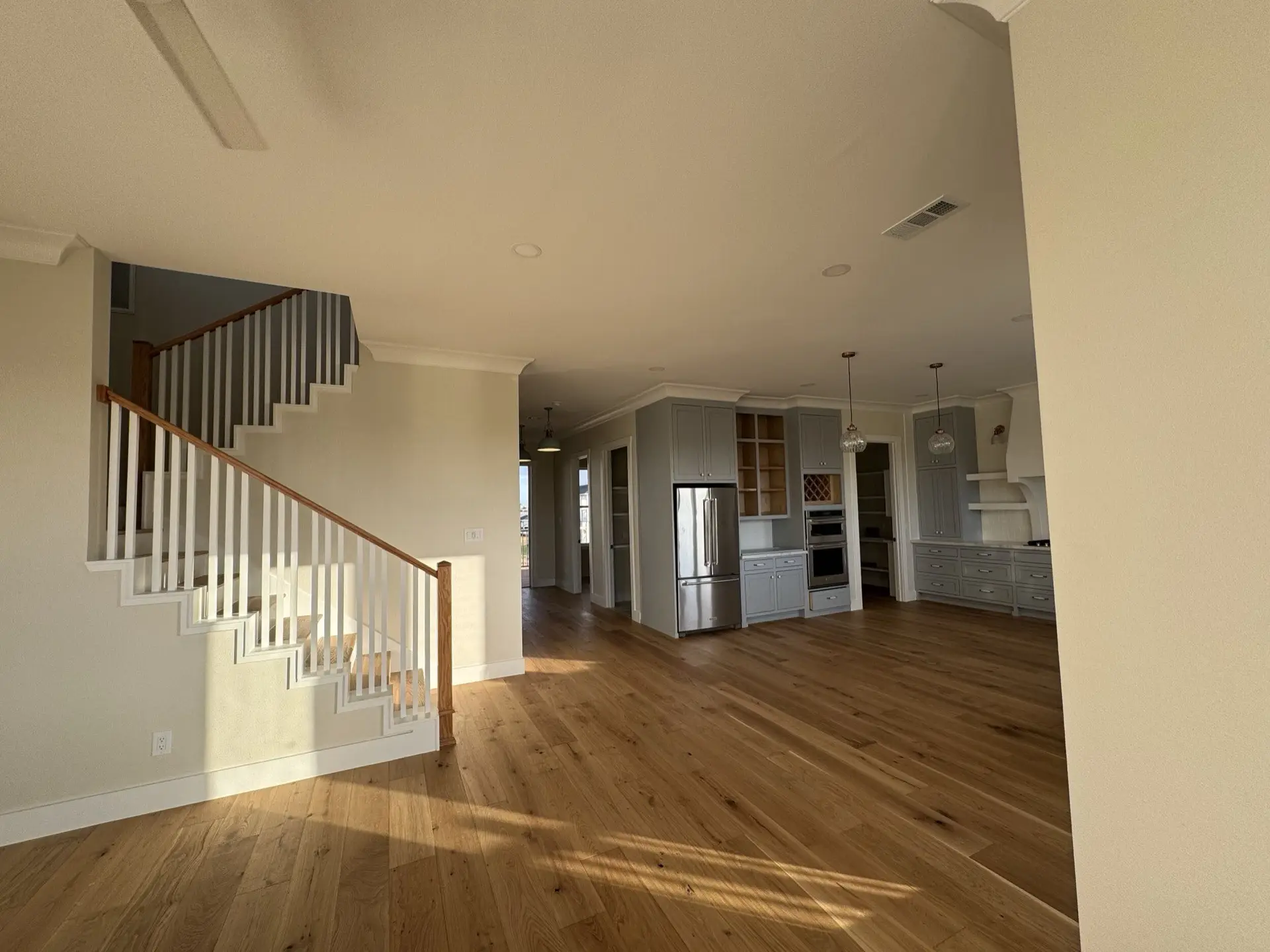 Guest bathroom with clean tile work, traditional vanity, and Craftsman-inspired hardware complementing the home's coastal style